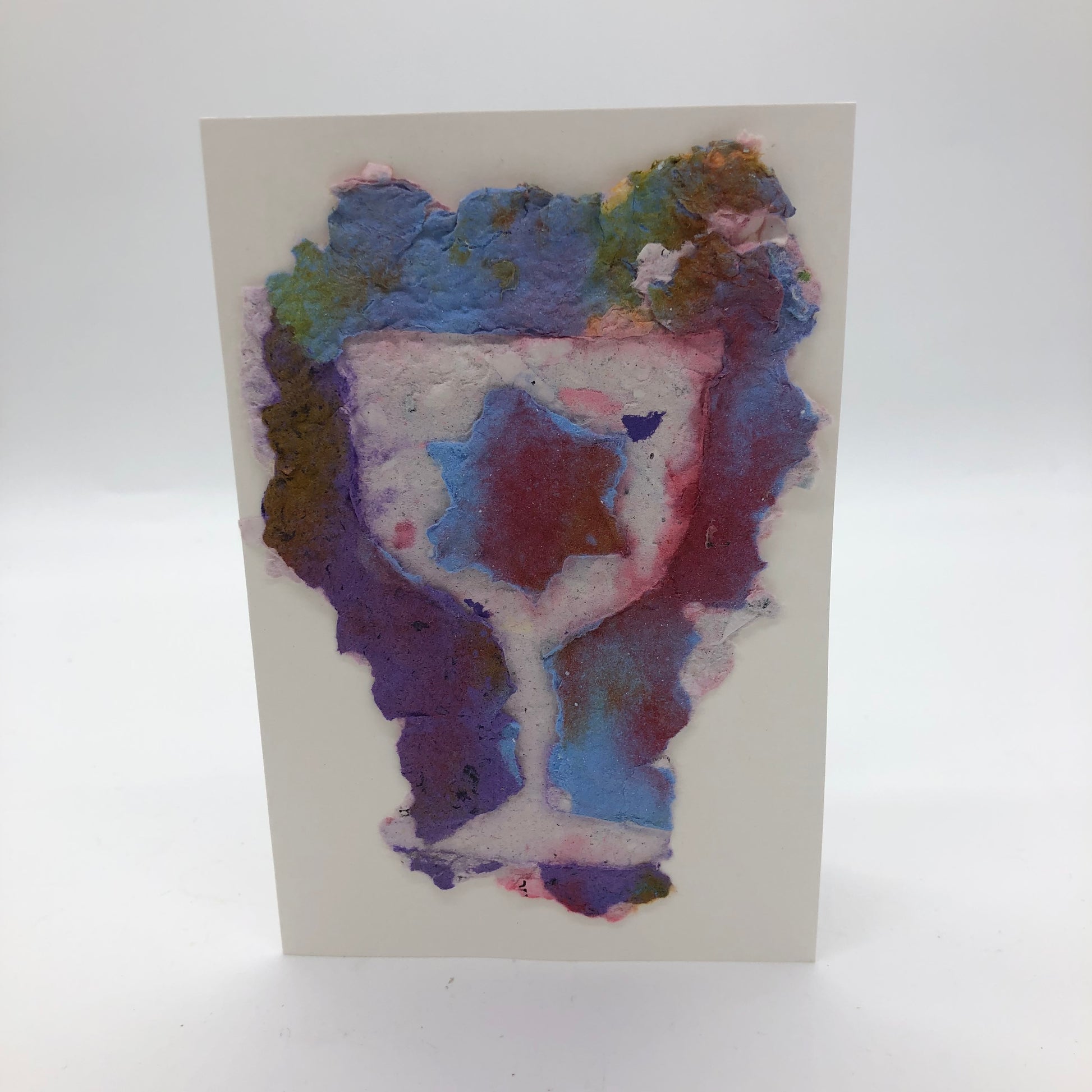 Handmade paper greeting card with white Kiddush cup and maroon/light blue Jewish star against maroon, purple and light blue background