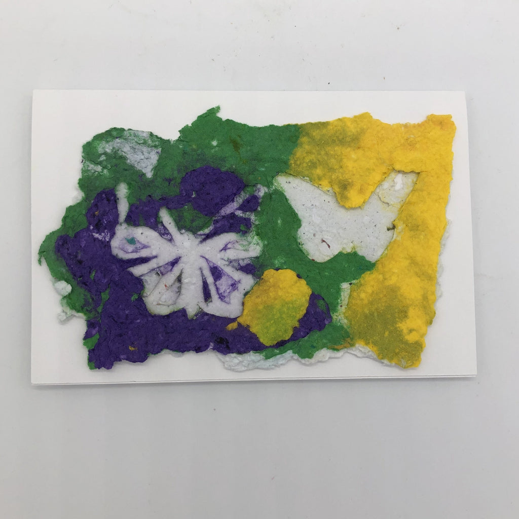 Handmade paper card in green, purple and yellow.  On the top are two white butterflies.  One is sold the other has details in shades of purple.