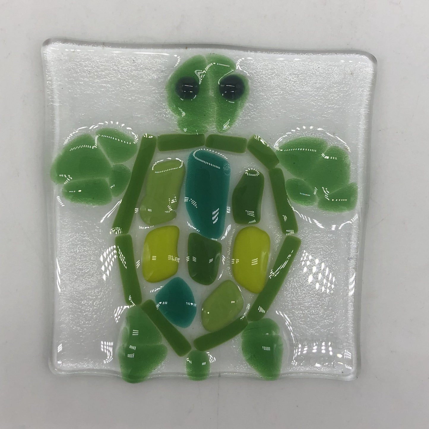 Clear square glass iwth sea turtle design in shades of green.