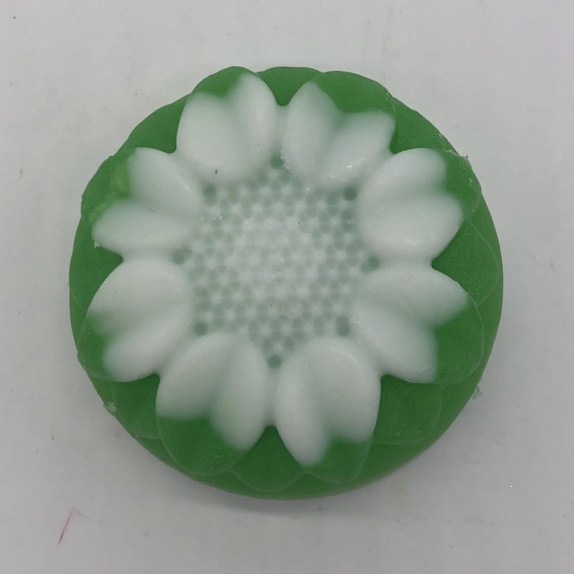 Green floral soap with white flower design