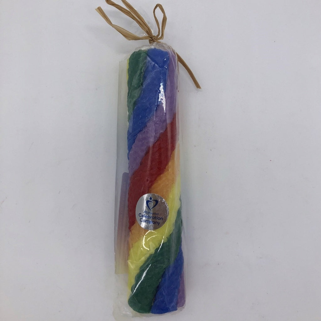 Beeswax pillar candle made from seven individual candles, rainbow colors twisted around a white candle.