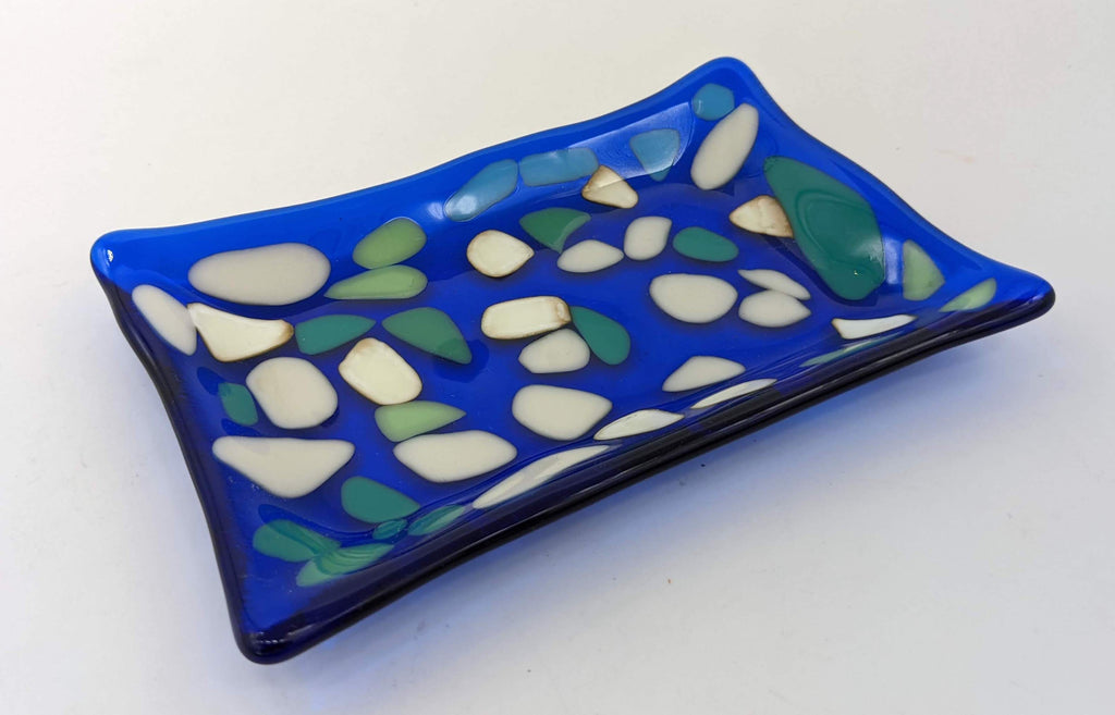 transparent blue soap dish with spots of blue and white 