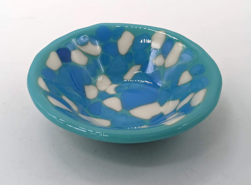 light blue bowl completely covered in blue and white
