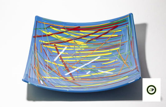 blue glass bowl with lines going in every direction