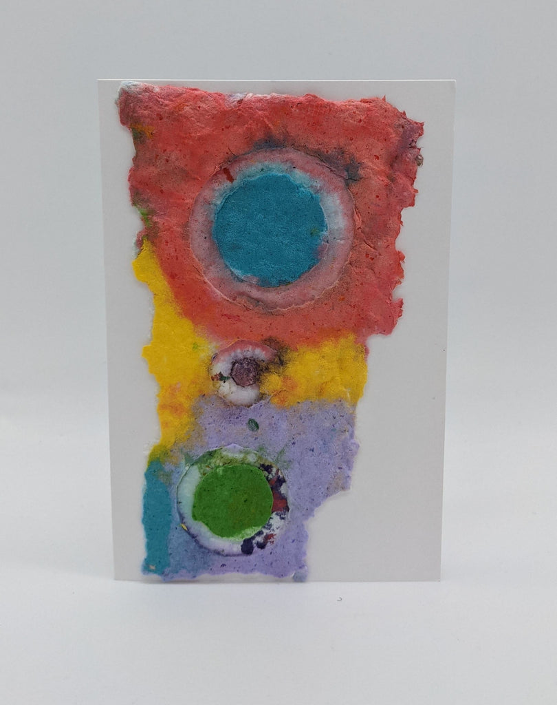 card with handmade paper with an impression of circles