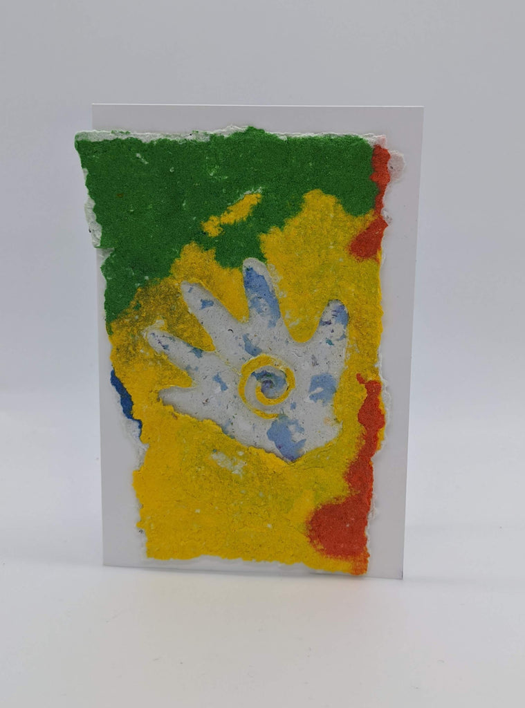 card with handmade paper with an impression of hand