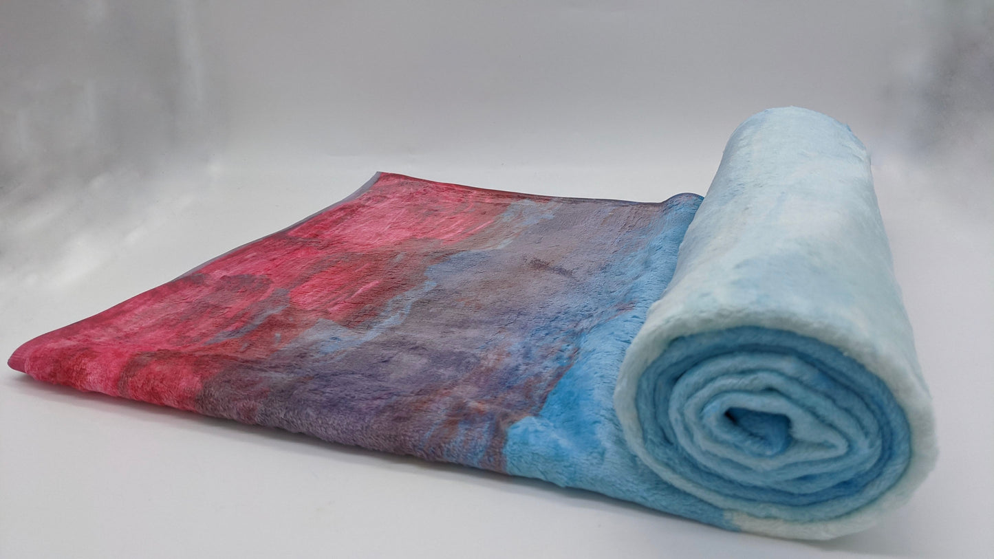 beach towel with red edge and gradients of blue