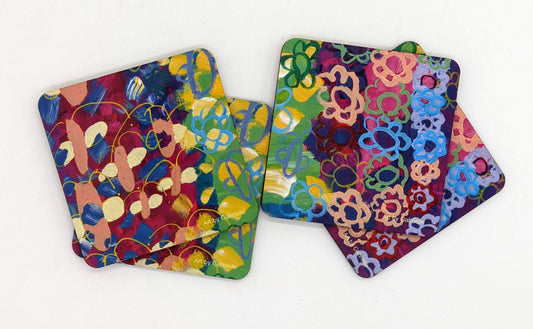 This is a set of four square coasters with the following painting on it: This painting is a multicolored background including purple, green and pink. There are a series of abstract paint dashes on it and several flowers in abstract form.