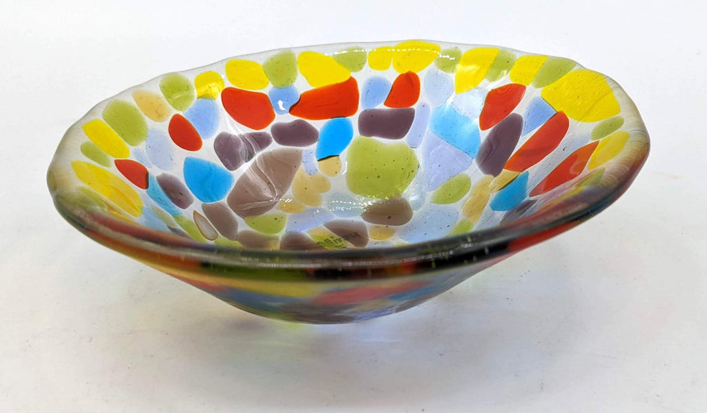 clear glass bowl completely covered in transparent colors