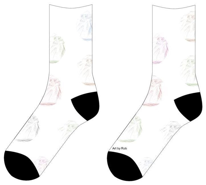 White socks with circles of tinted color of Graphite drawing of a person with a hat and coat standing. The facial features are drawn darker and finer than the shaded outlines. There are faint buttons drawn going down the torso of the person