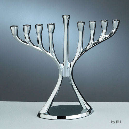 modern silver menorah in front of a grey background