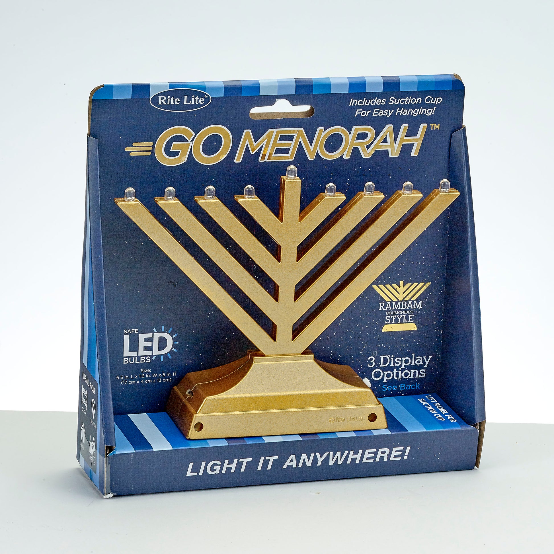 gold electric menorah in blue cardboard packaging