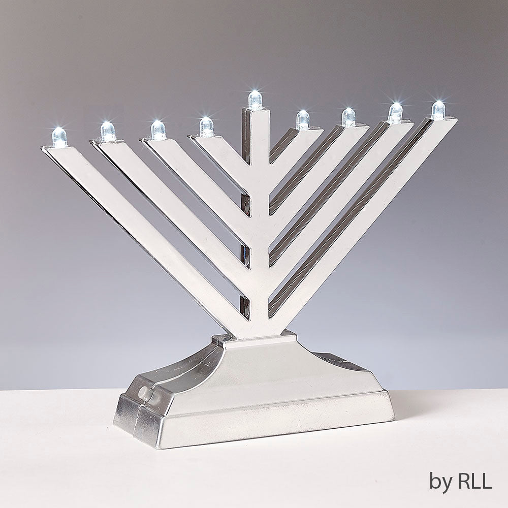 silver electric menorah in front of gray background
