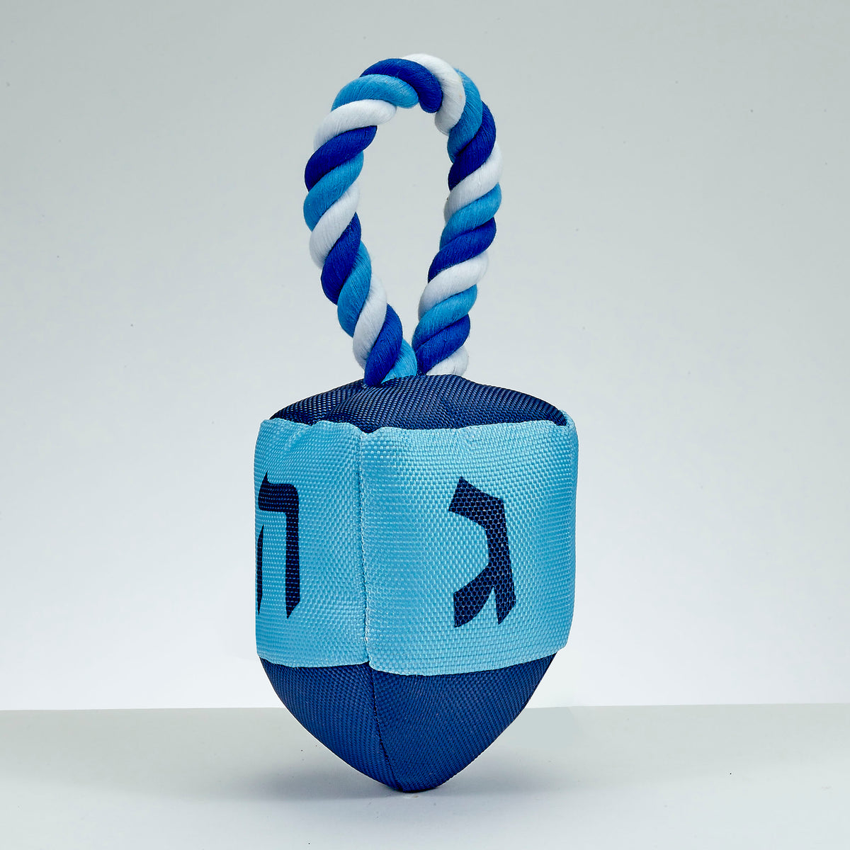 dreidel dog toy against a white background