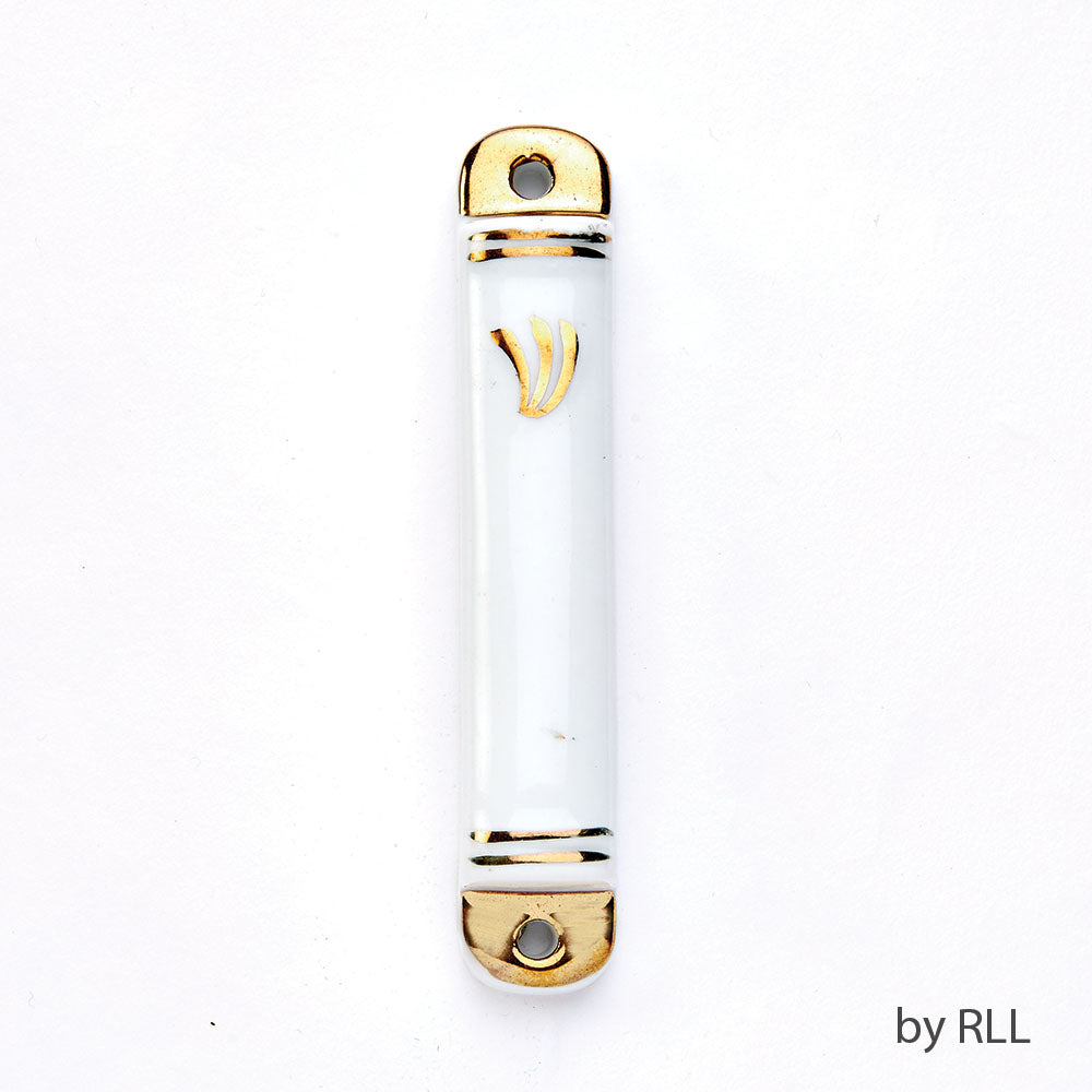 white ceramic cylinder with a golf Hebrew letter Shin on top