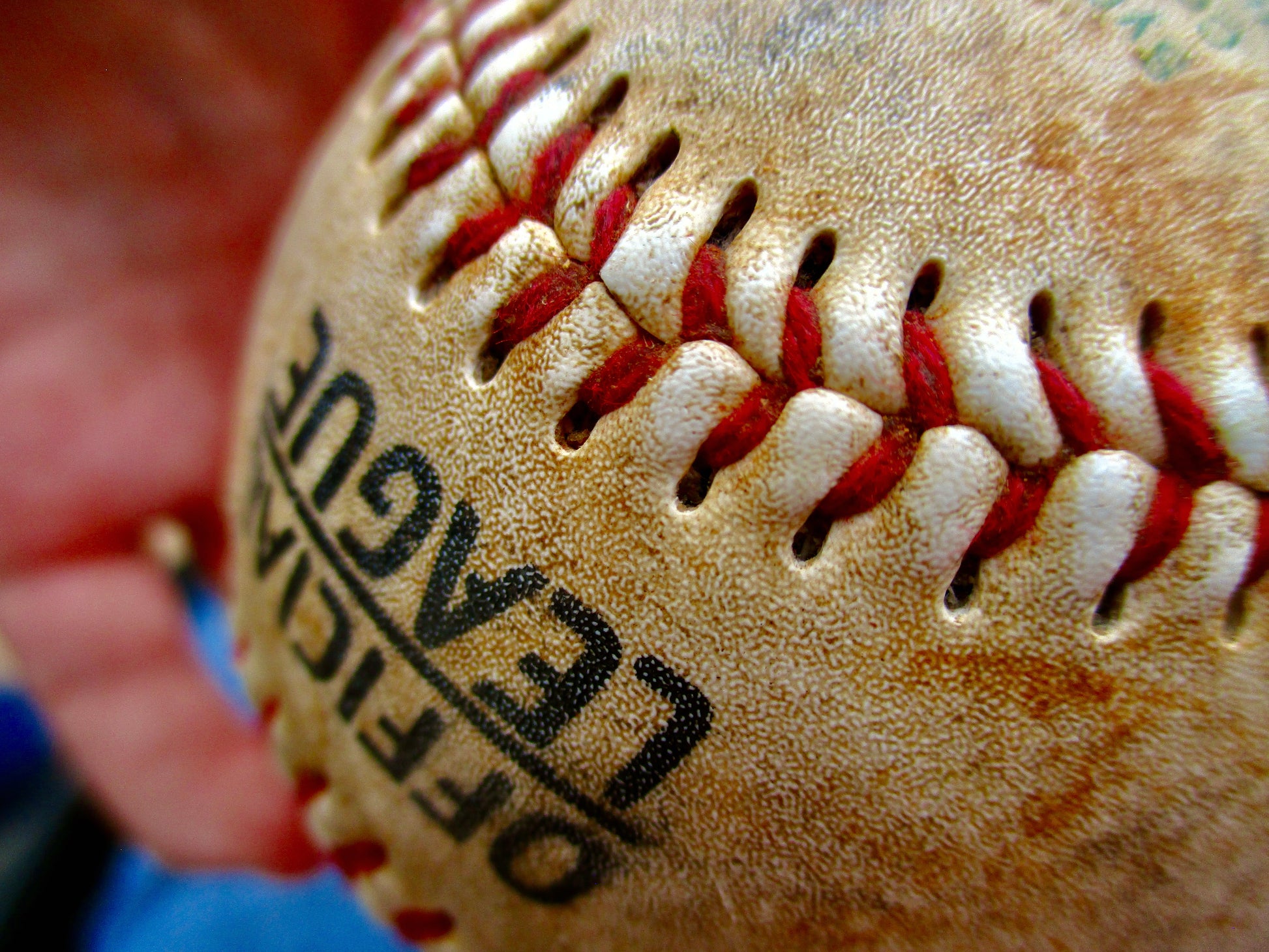 This is an up close photo of a baseball