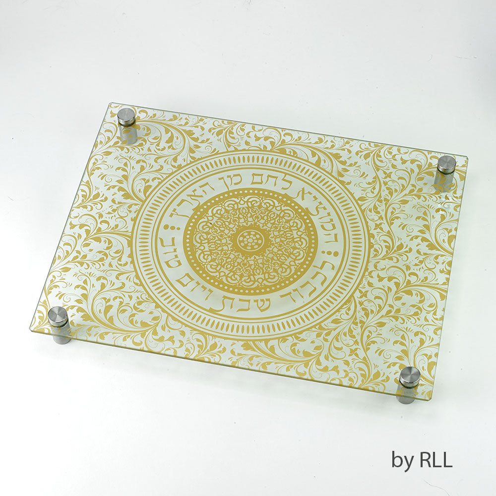 Glass challah cutting board with gold paisley print and Hamotzi prayer in a circle in the middle