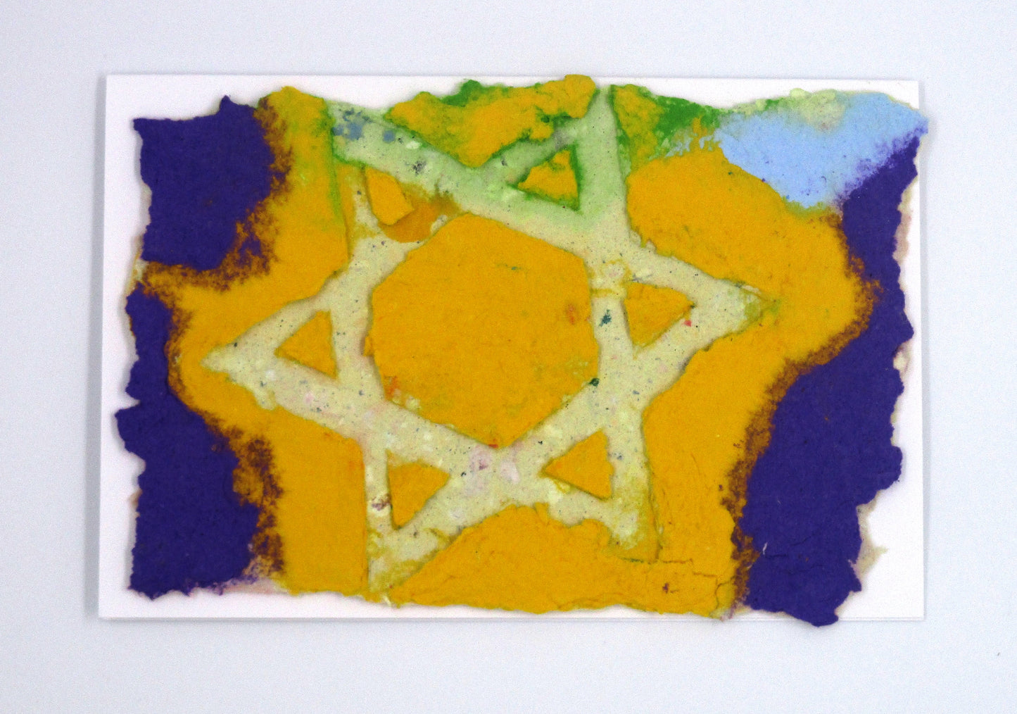 Large outline Star of David on handmade paper of  yellow and purple