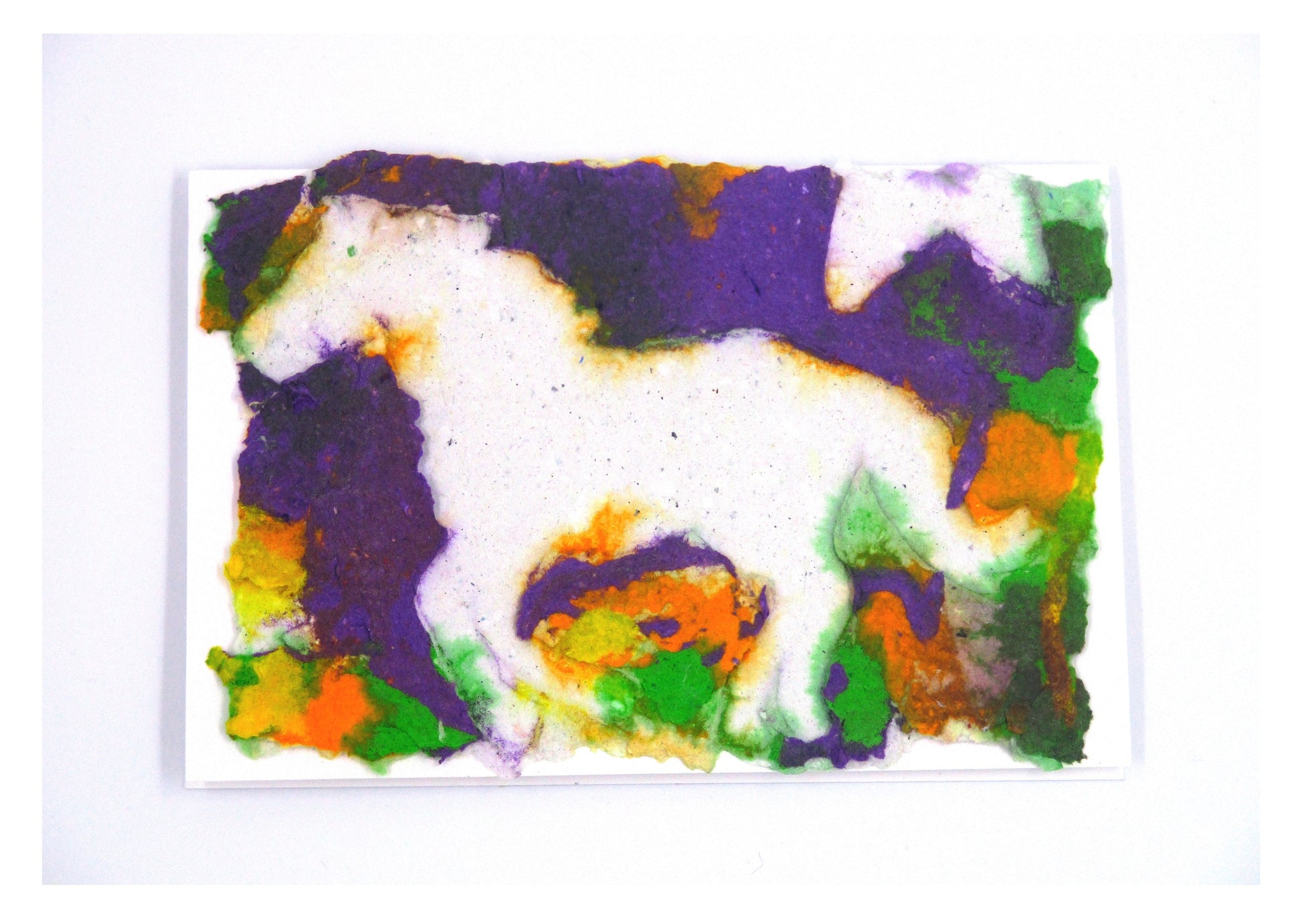 card with handmade paper design of a horse. vivid colors of purple, orange and green