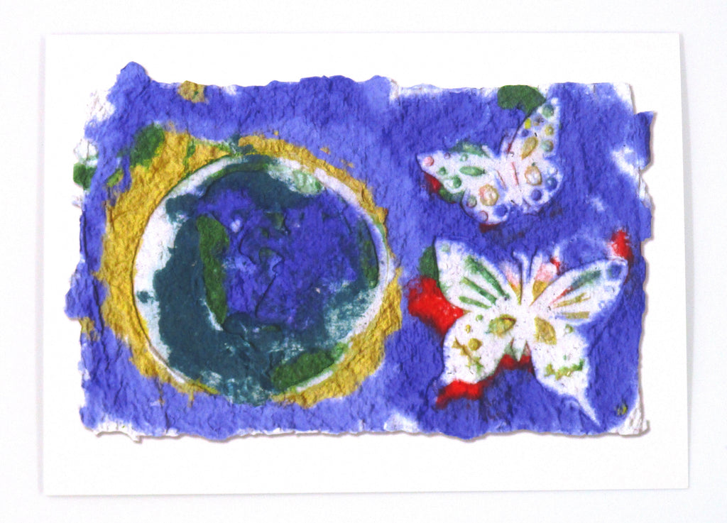 Graphic greeting card with indigo background and a picture of Earth surrounded by a yellow outline on the left side and two white butterflies on the right side