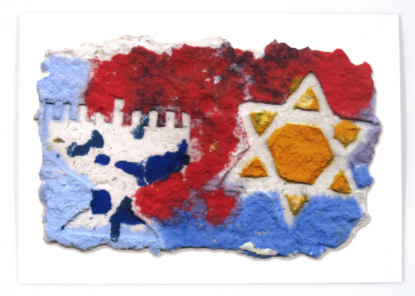 Printed card of handmade paper in shades of blue, red and orange.  Menorah and Star of David shapes, in white on top.