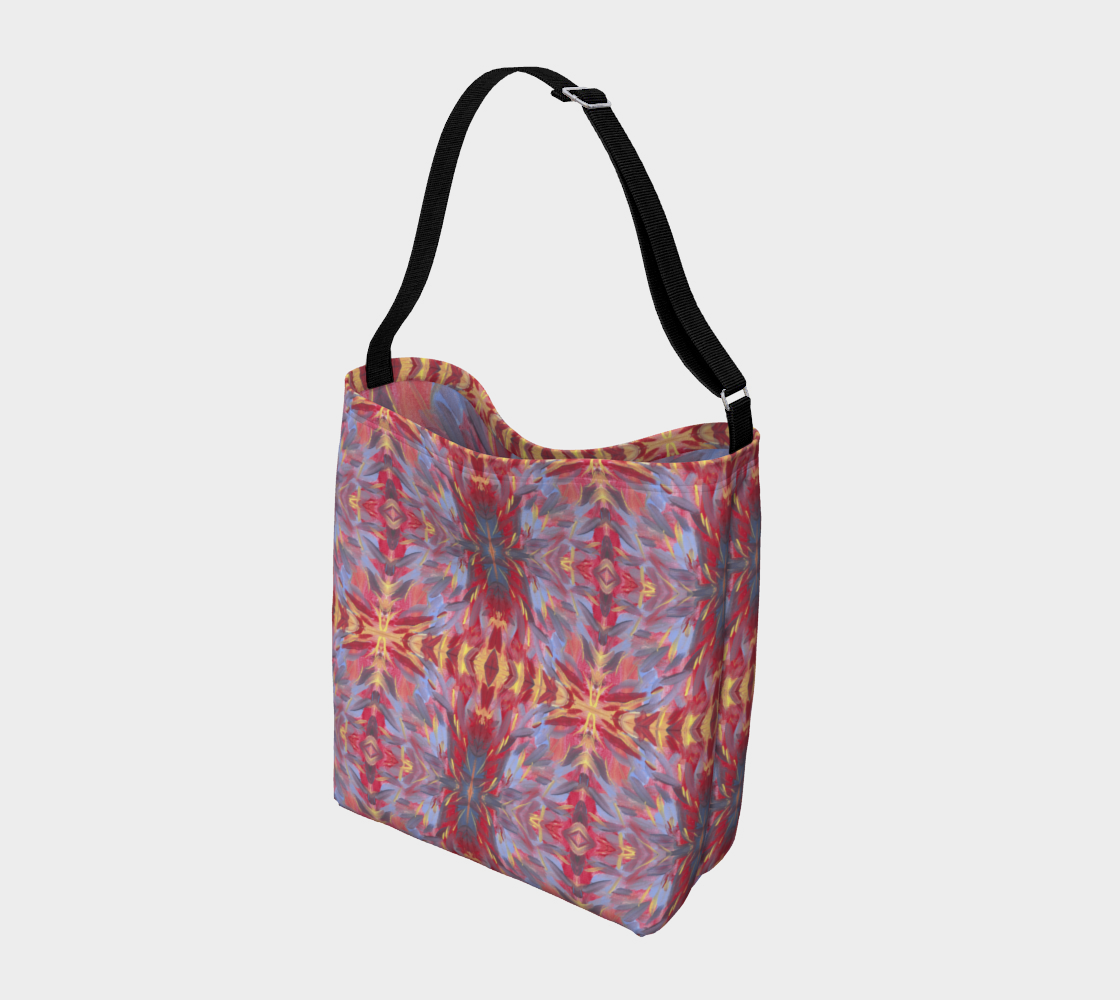 Crossbody Bag with black strap and designed with  a background of orangish red with a touch of yellow are mostly diagonal streaks of sky blue, gray, yellow, and deep red. The streaks look somewhat like feathers.