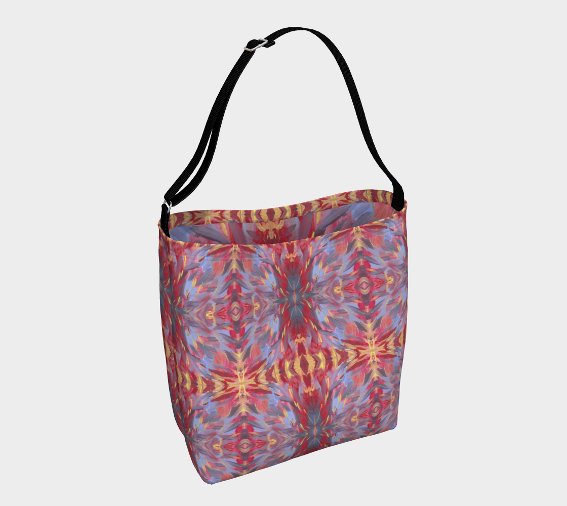 Crossbody Bag with black strap and designed with a background of orangish red with a touch of yellow are mostly diagonal streaks of sky blue, gray, yellow, and deep red. The streaks look somewhat like feathers.