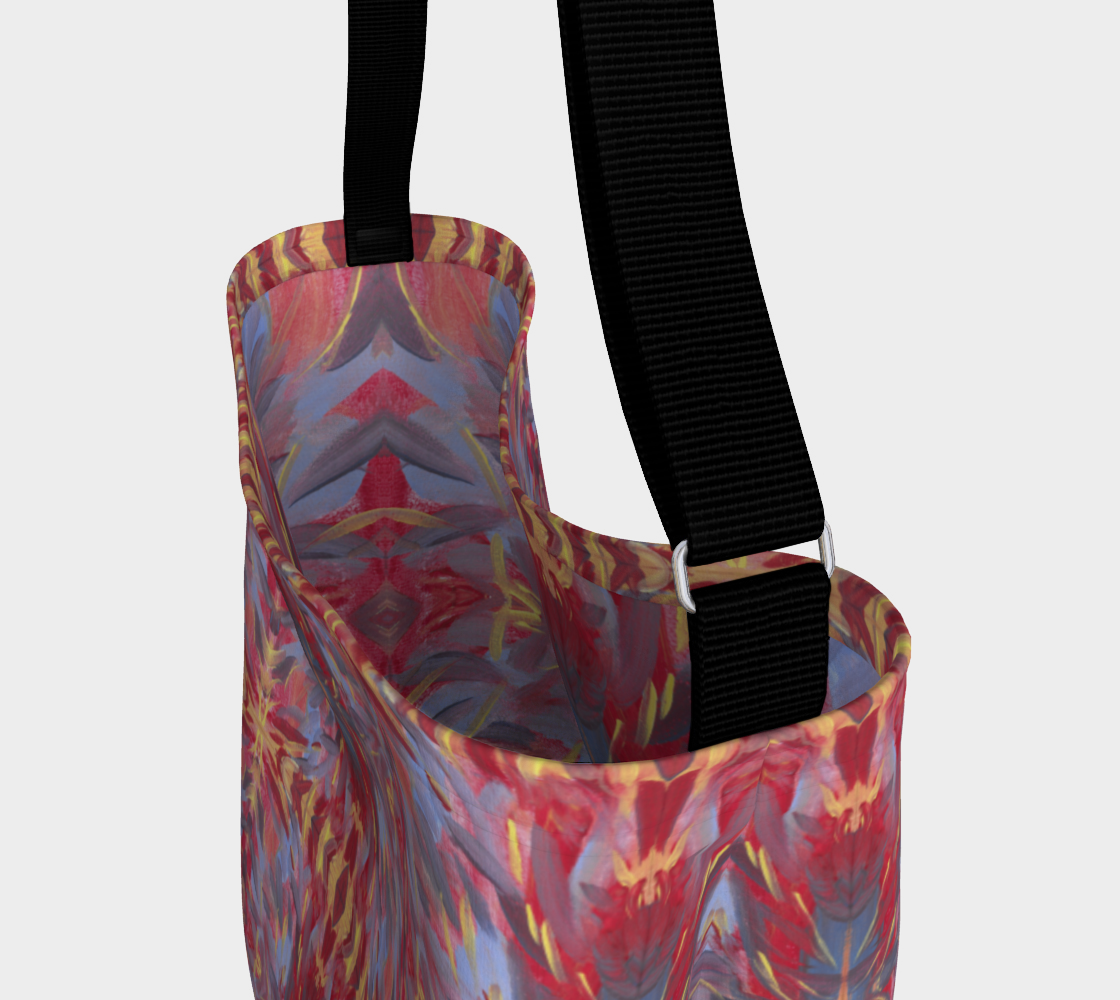 Photo showing inside of Crossbody Bag with black strap and designed with a background of orangish red with a touch of yellow are mostly diagonal streaks of sky blue, gray, yellow, and deep red. The streaks look somewhat like feathers.