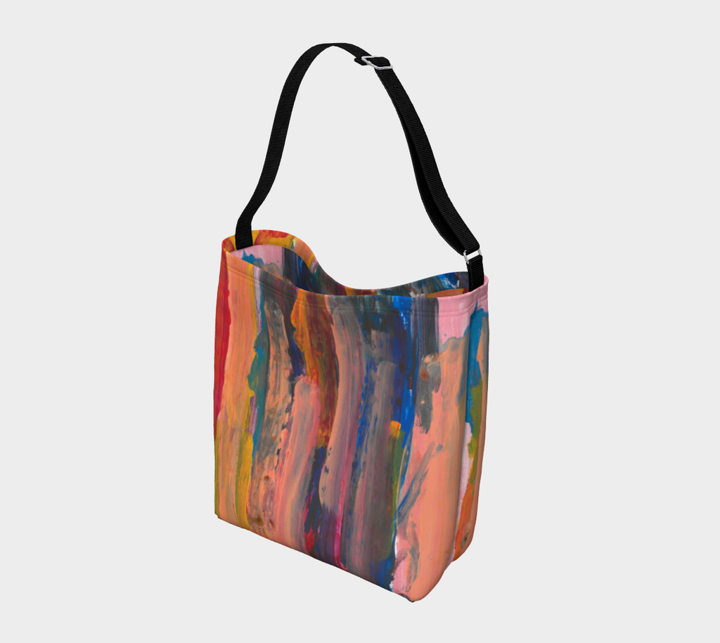 Crossbodu Bag designed with Layers of vertical brushstrokes overlapping. In the center the background is a dark blue, to the left is yellow, and the right is pink. The top layer of brushstrokes are mostly a pale pink