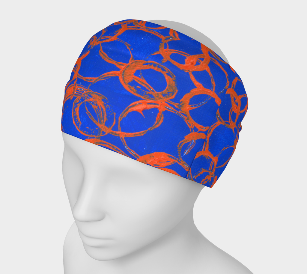 Mannequin wearing royal blue headband on with orange overlapping rings of various sizes