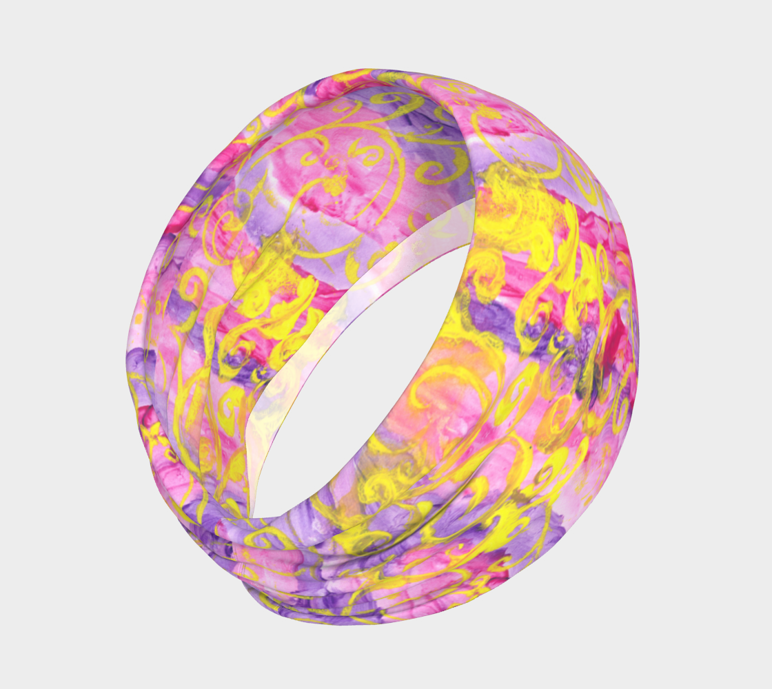 Headband with pink and purple stripes and yellow swirls all around.
