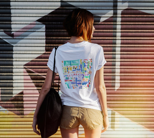 Model wearing white tshirt depicting square artwork with free form shapes of blue, purple, green, yellow, orange and red colors.