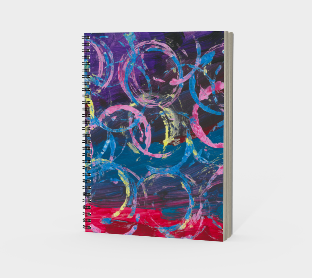 This is a notebook with a red purple and blue background and multicolored overlapping circles