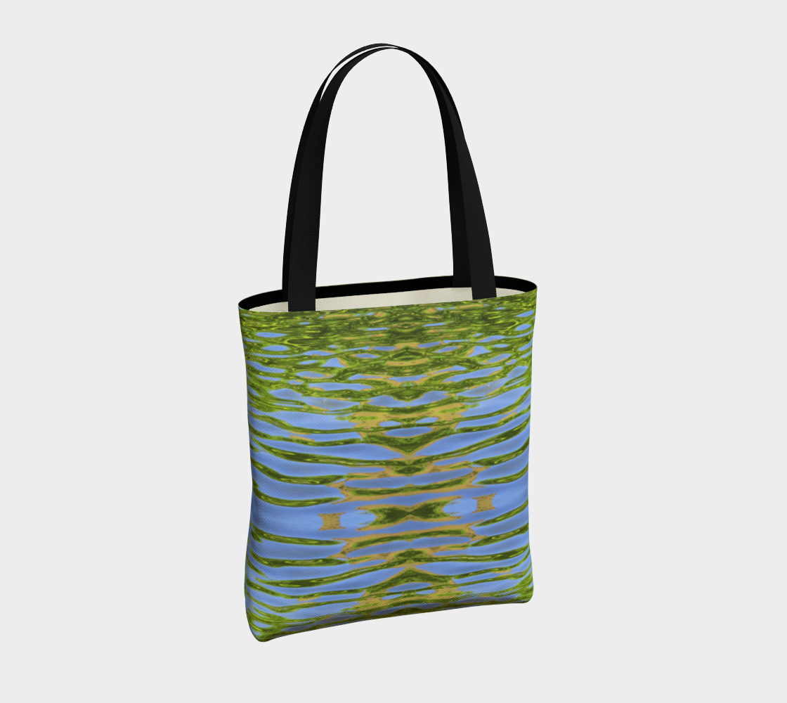 Canvas tote bag with black cotton straps. The pattern is of reflecting water and leaves