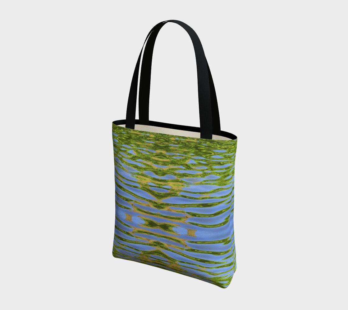 Canvas tote bag with black cotton straps. The pattern is of reflecting water and leaves