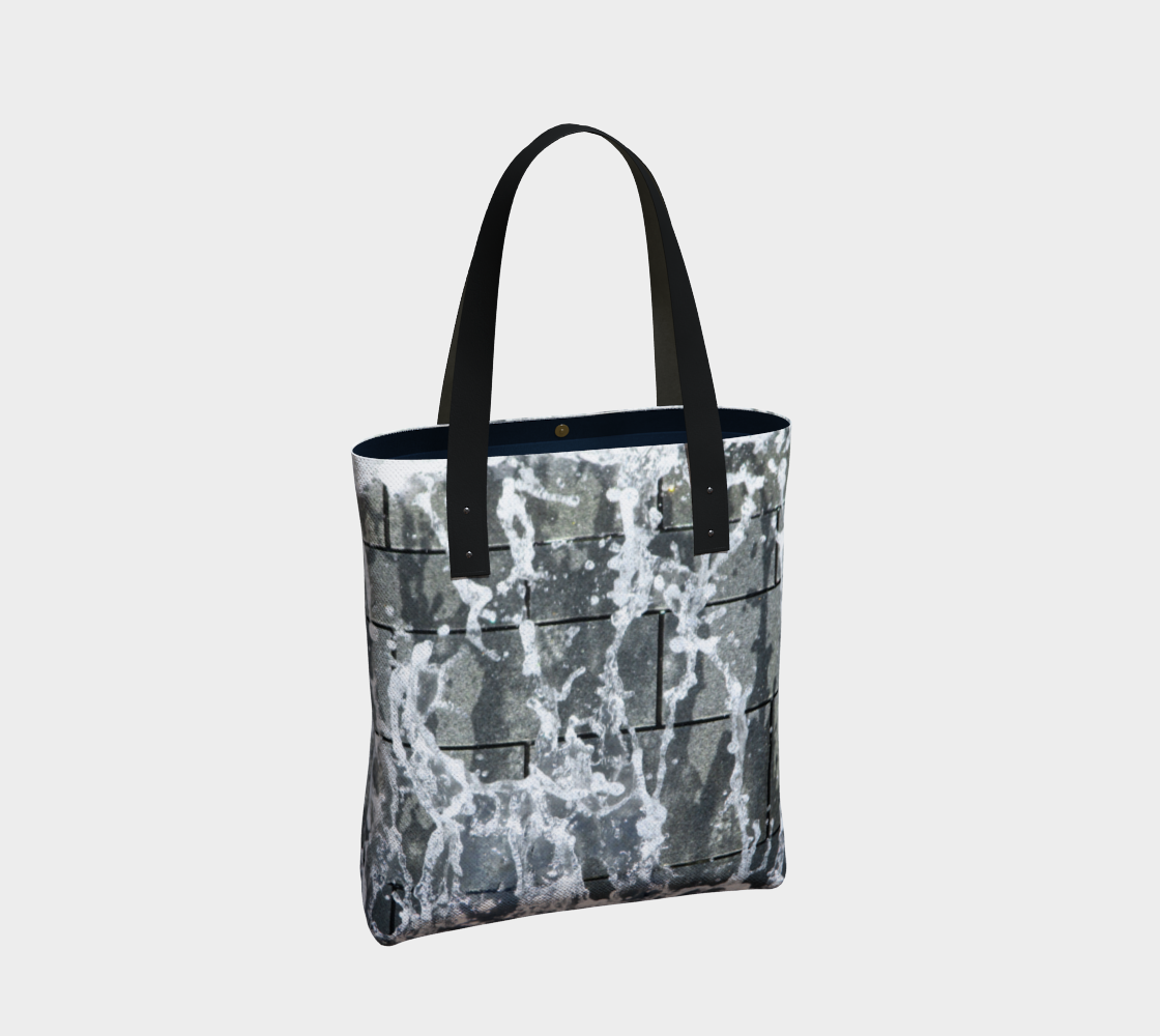 Totebag with double black straps with gray, white and black design depicting running water