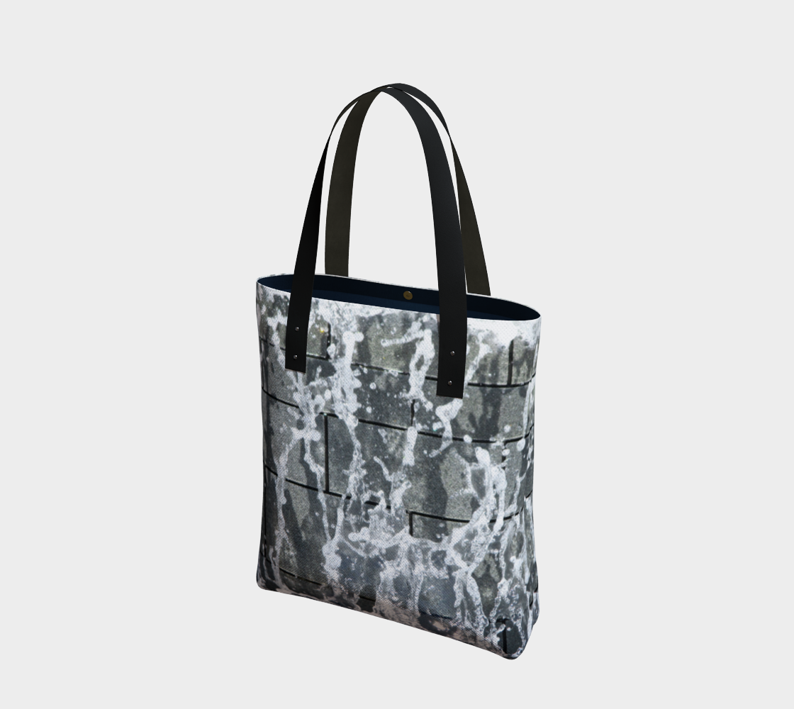 Totebag with double black straps with gray, white and black design depicting running water