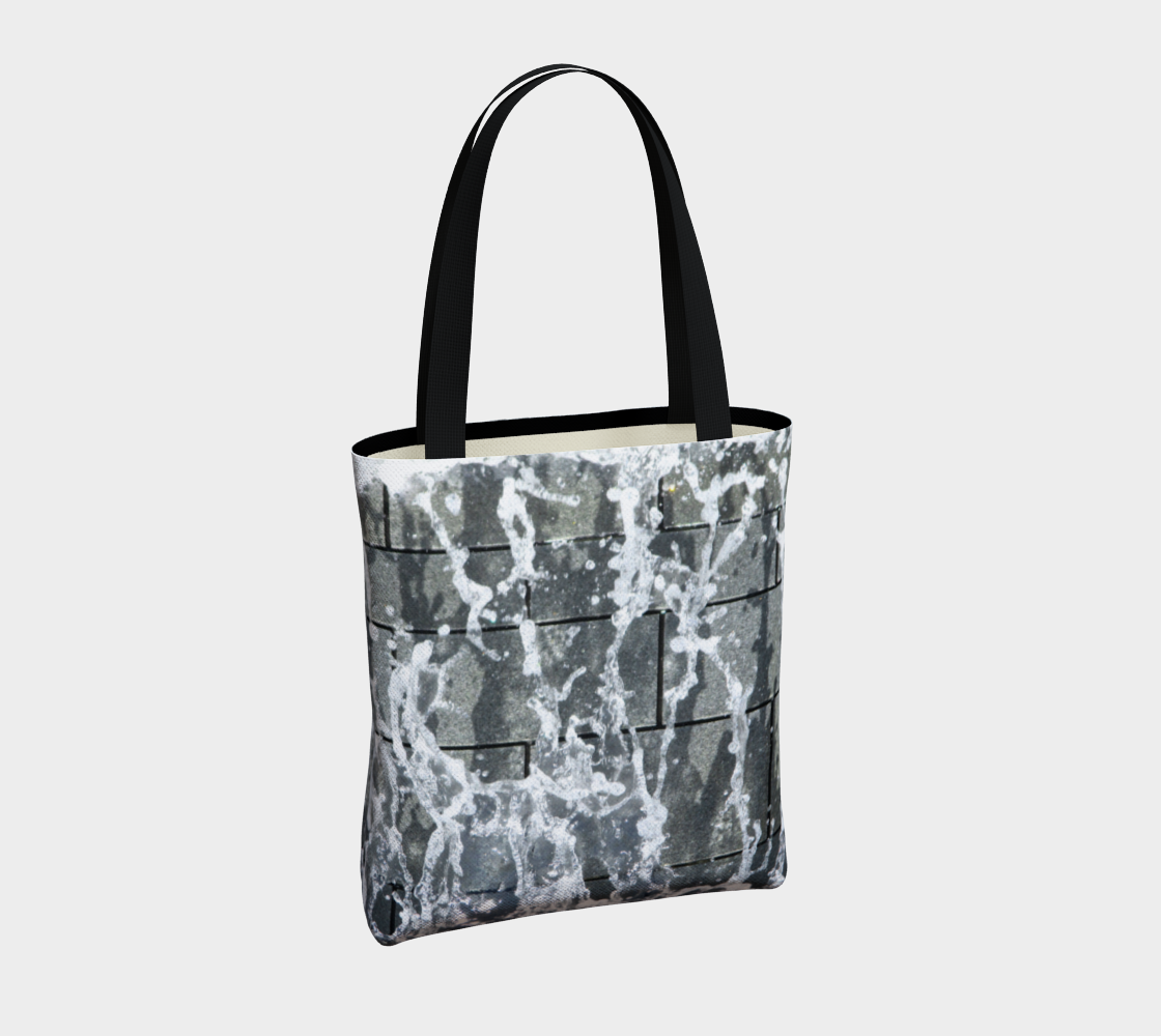 Totebag with double black straps with gray, white and black design depicting running water