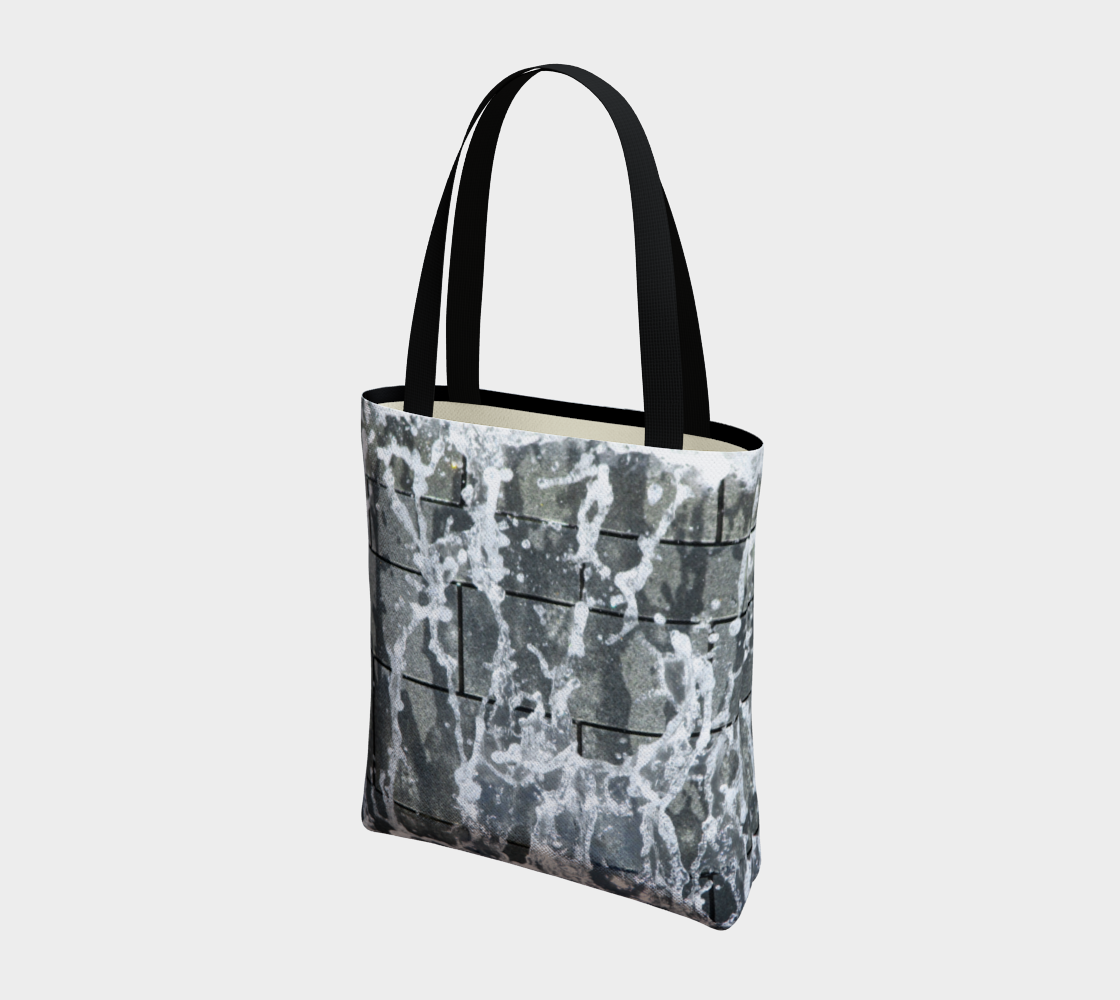 Totebag with double black straps with gray, white and black design depicting running water