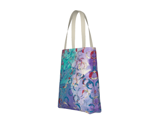 This is a totebag with the following painting: This is a painting with a green and purple background and circular imprints on top in red white and blue