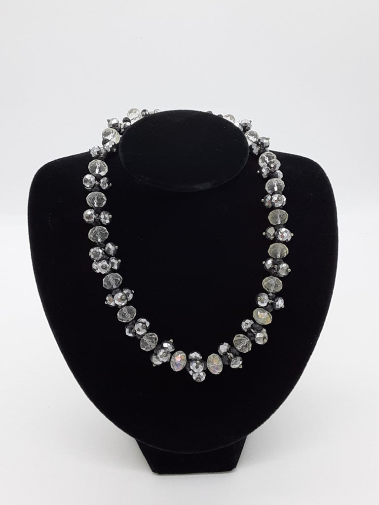 Necklace with clear, silver, and black faceted beads