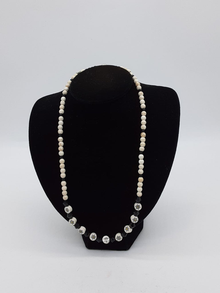 black and white beaded necklace with stars of davids in the center