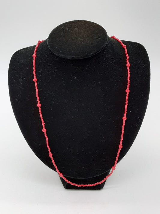 red necklace made with seed beads