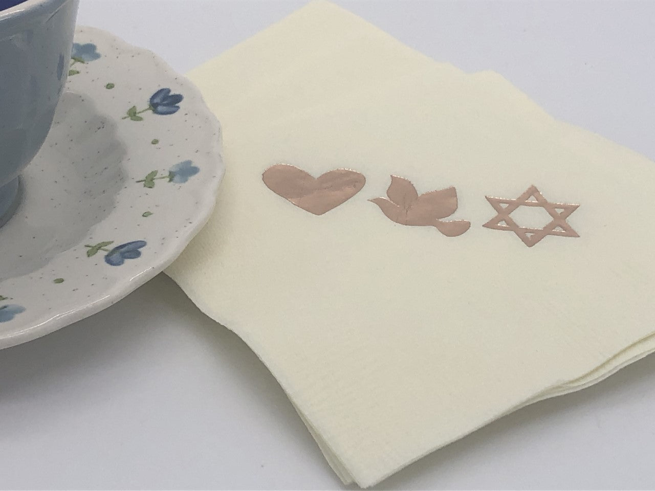 Ivory cocktail napkin with gold heart, dove and Jewish star graphics