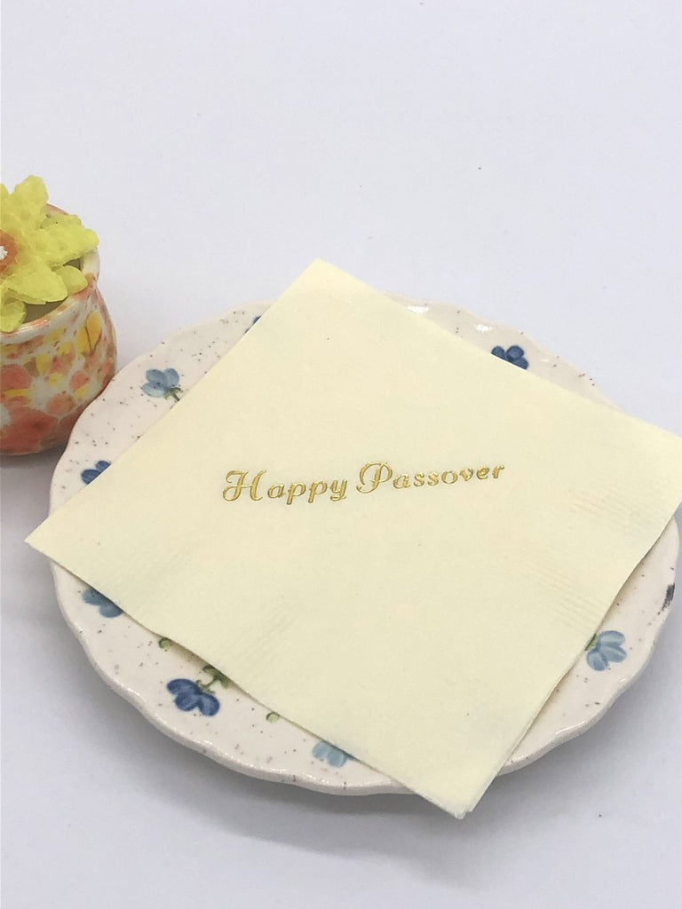 Ivory cocktail napkin with gold Happy Passover slogan