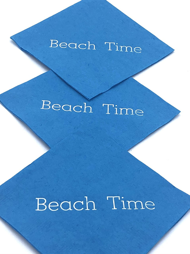 Light blue cocktail napkins with silver Beach Time slogan