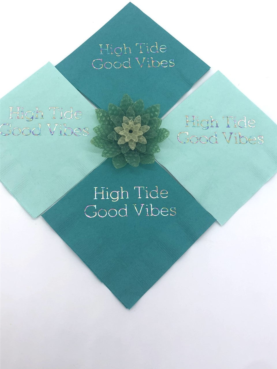 Teal and seafoam cocktail napkins with iridescent High Tide Good Vibes slogan