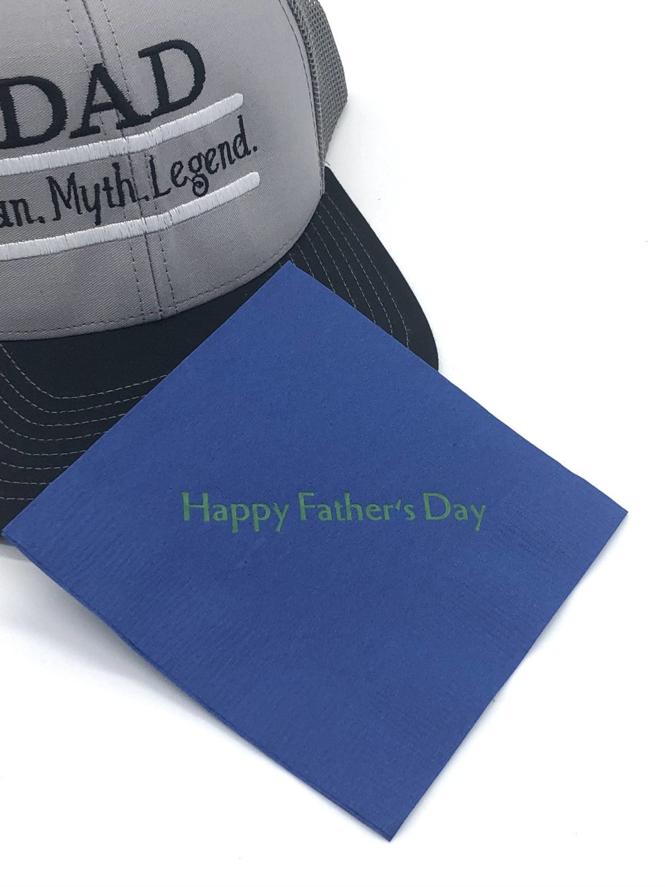 Dark blue cocktail napkins with green Happy Father's Day slogan