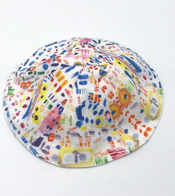 multi colored kippah on a white background