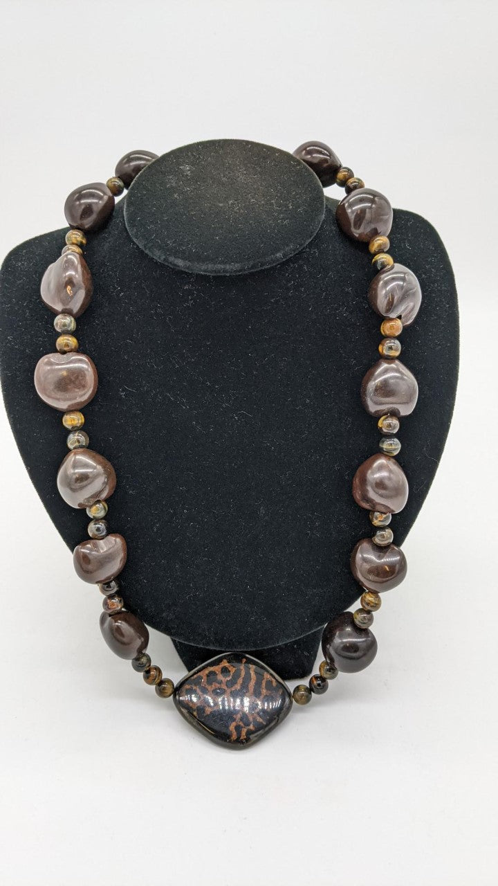 Dark brown necklace with large light weight beads and small tiger eye beads in between